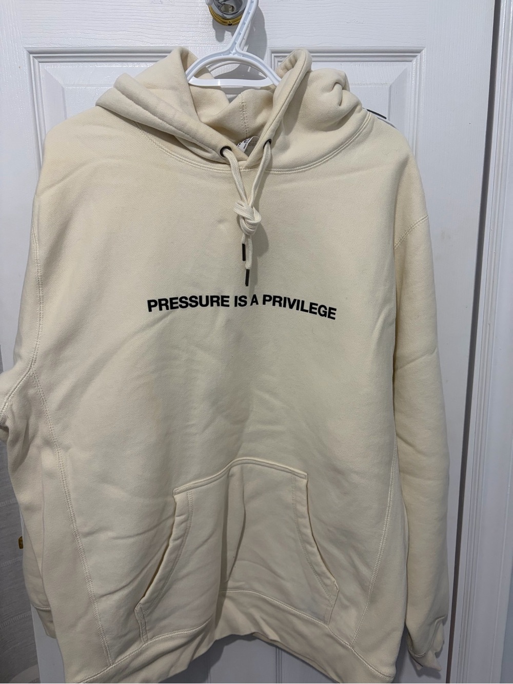 Cream Pullover Hoodie with 'Pressure Is A Privilege' Chest Print